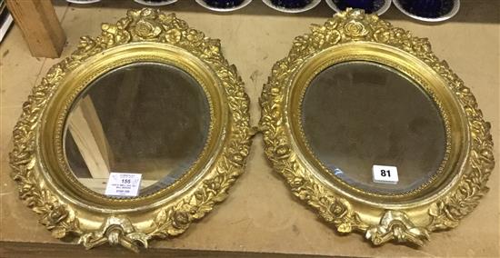 Pair of small oval gilt wall mirrors
